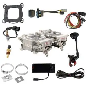 Carburetor conversion kit with various components.