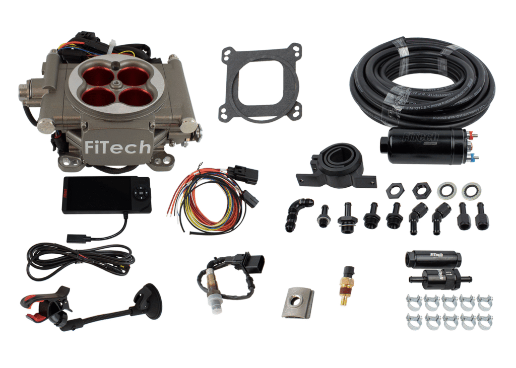 Complete carburetor repair kit with various components and wiring.