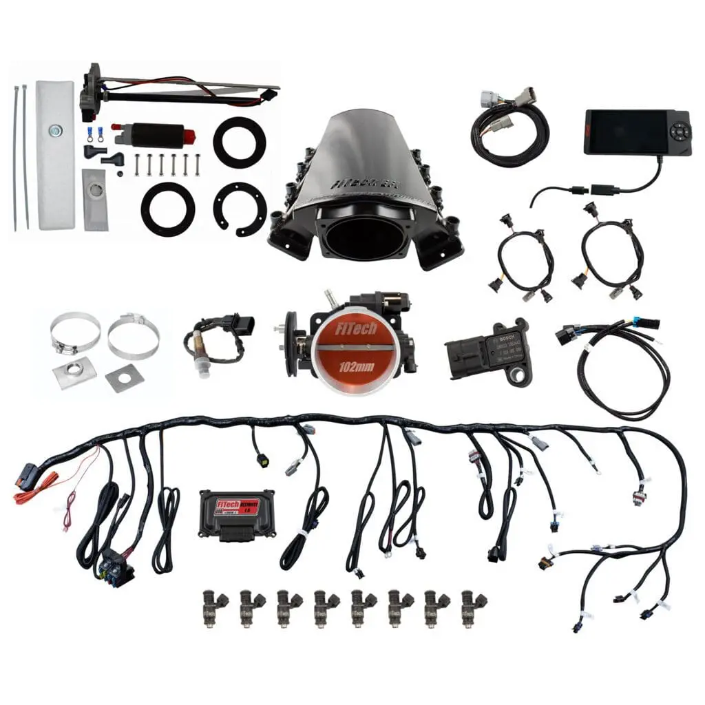 Complete car turbo kit with various components and wiring.