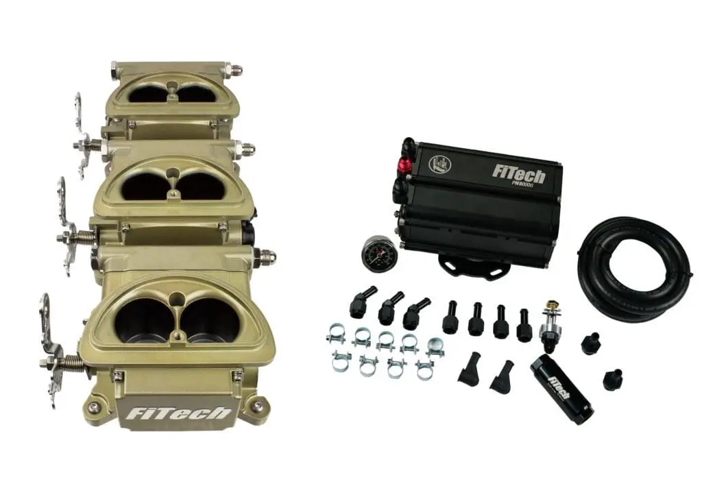 Fuel injection system kit with throttle bodies and control unit.