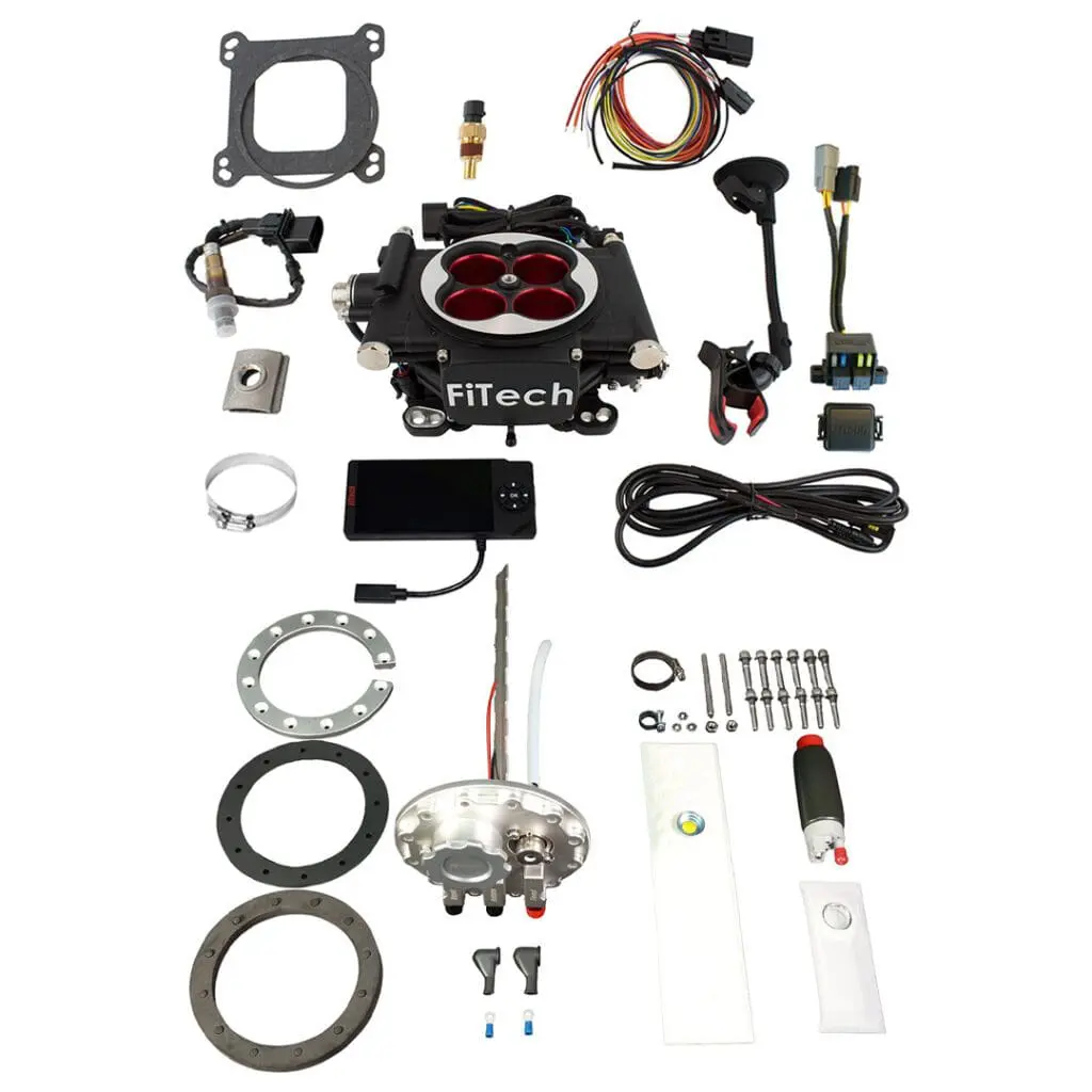Complete motorcycle carburetor rebuild kit with various parts and tools.