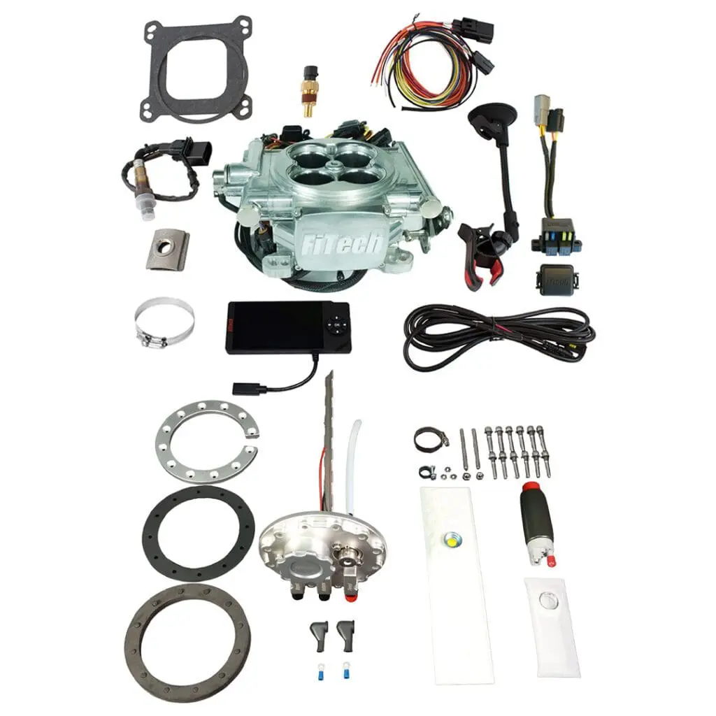 Complete carburetor rebuild kit with various components.