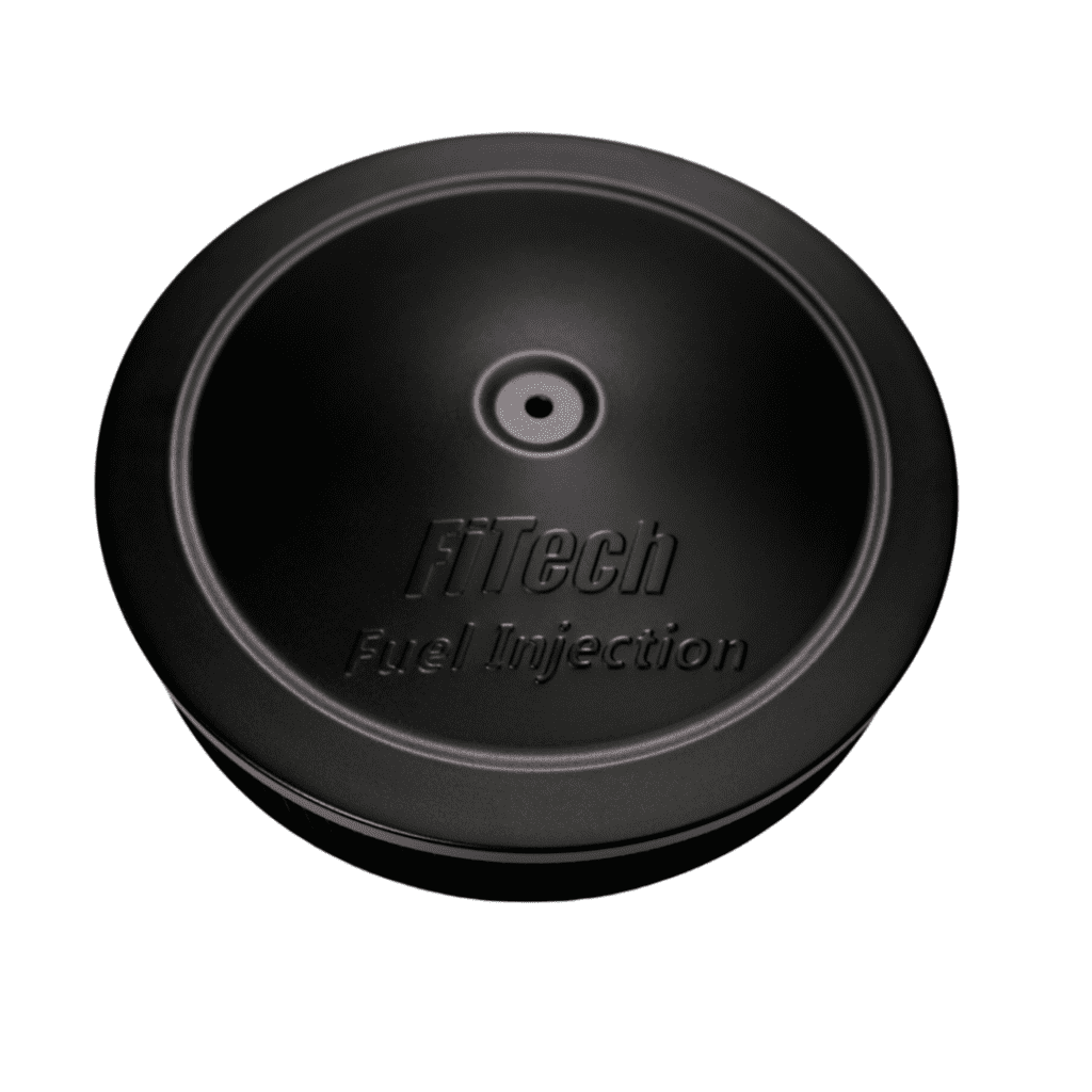 A black, circular wireless charging pad with a textured surface.
