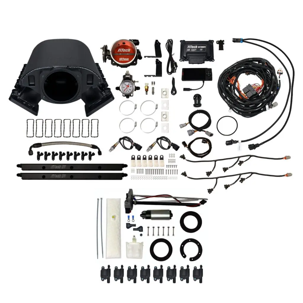 Car engine parts and accessories laid out.