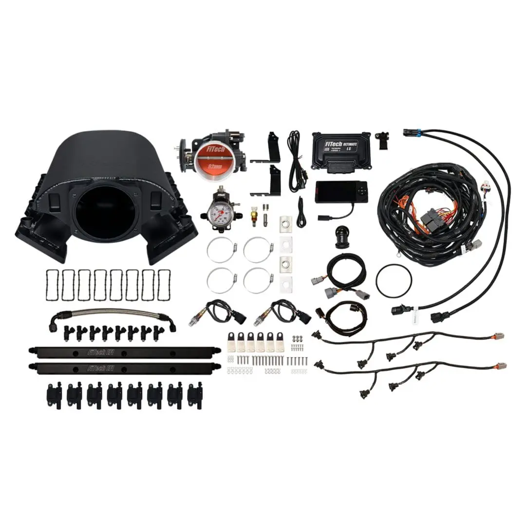 Car engine components and wiring kit displayed.