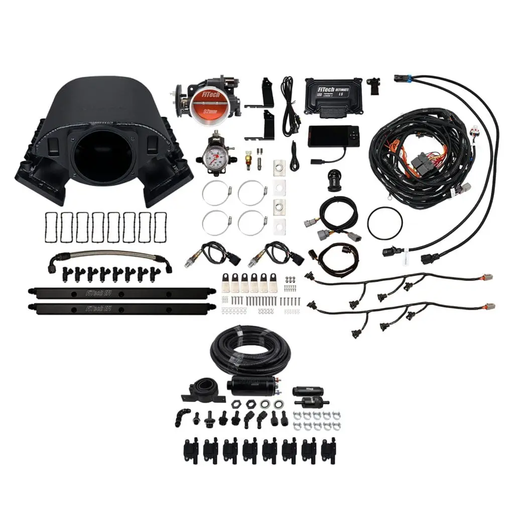 Automotive engine components and wiring kit displayed.