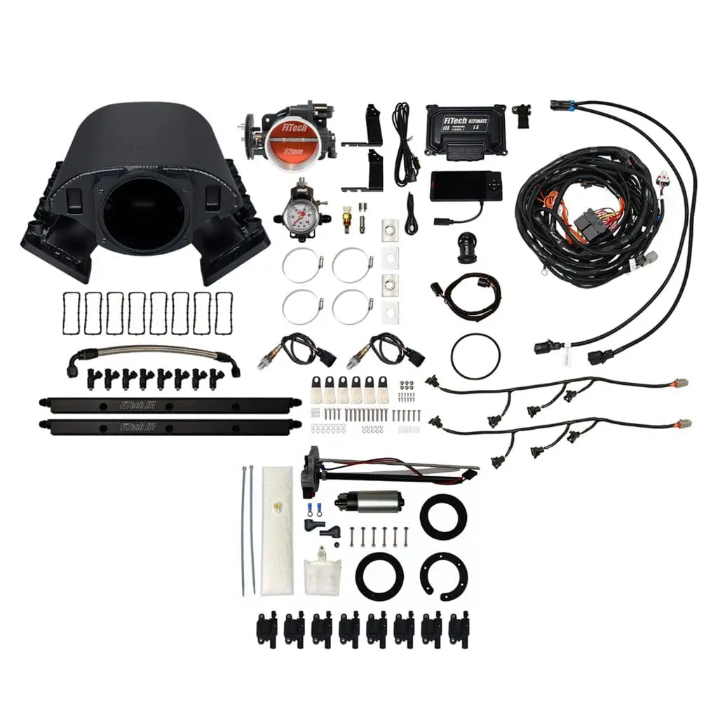 Car engine turbo kit components laid out.