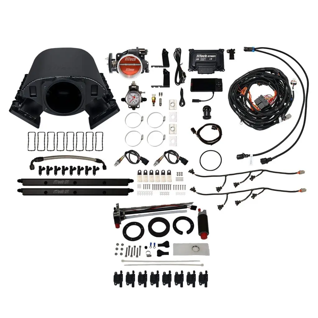 Car engine parts and wiring components displayed.