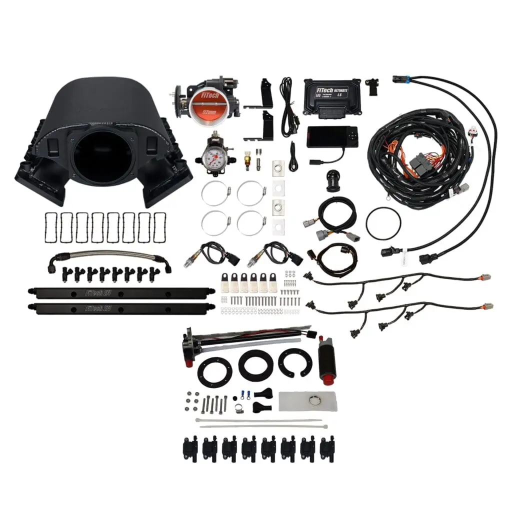 Engine component kit with various parts displayed.