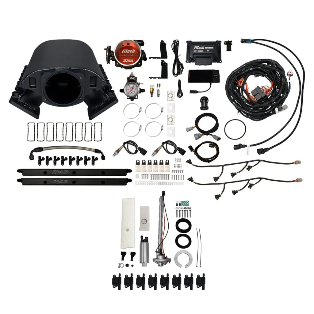 Car engine parts and wiring kit components.