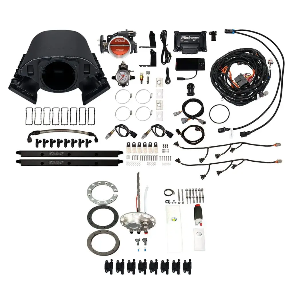 Car engine parts and wiring kit displayed.