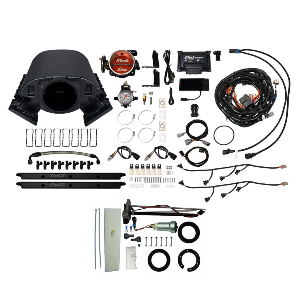 Complete carburetor rebuild kit with various parts and tools.