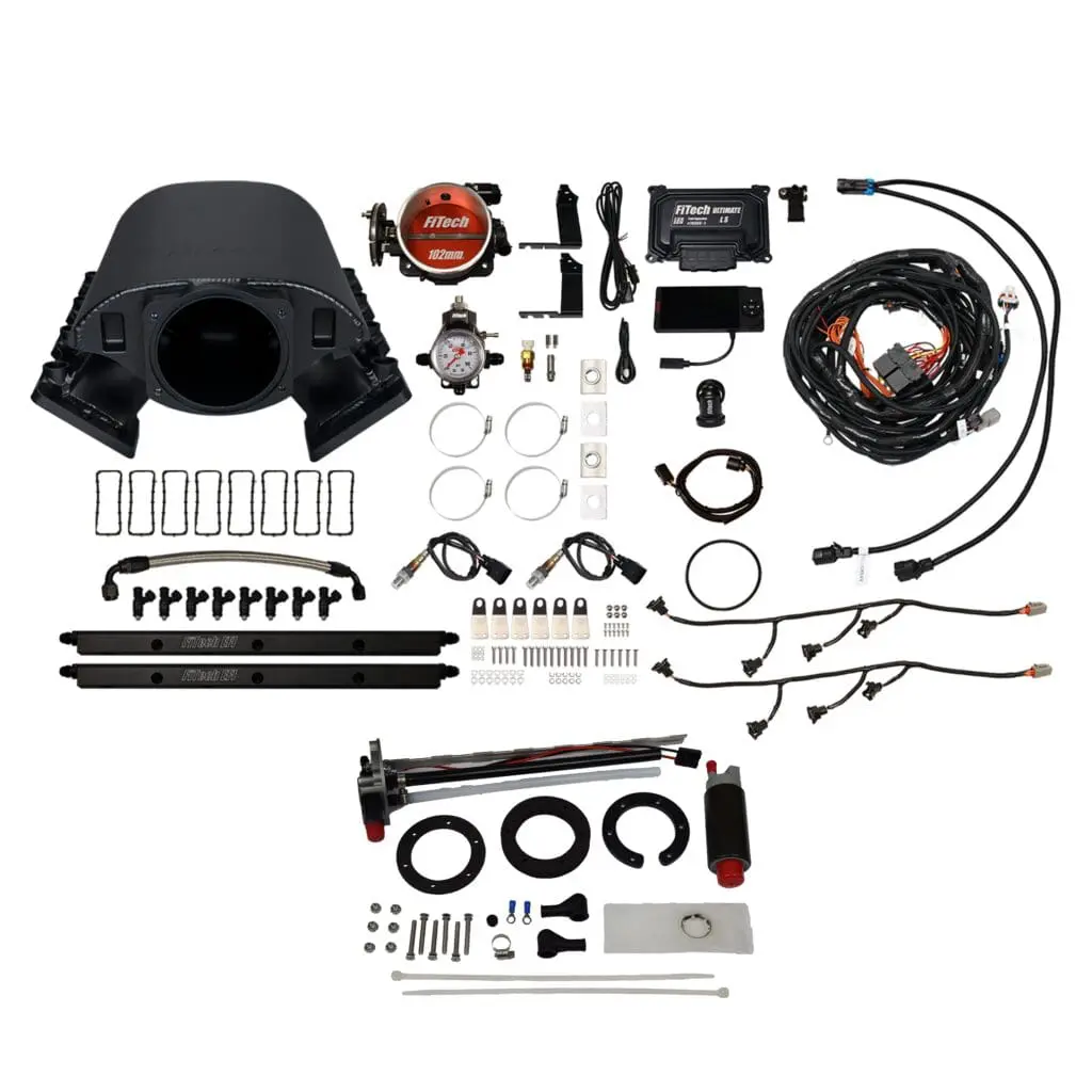 Complete vehicle conversion kit with various automotive parts and cables.
