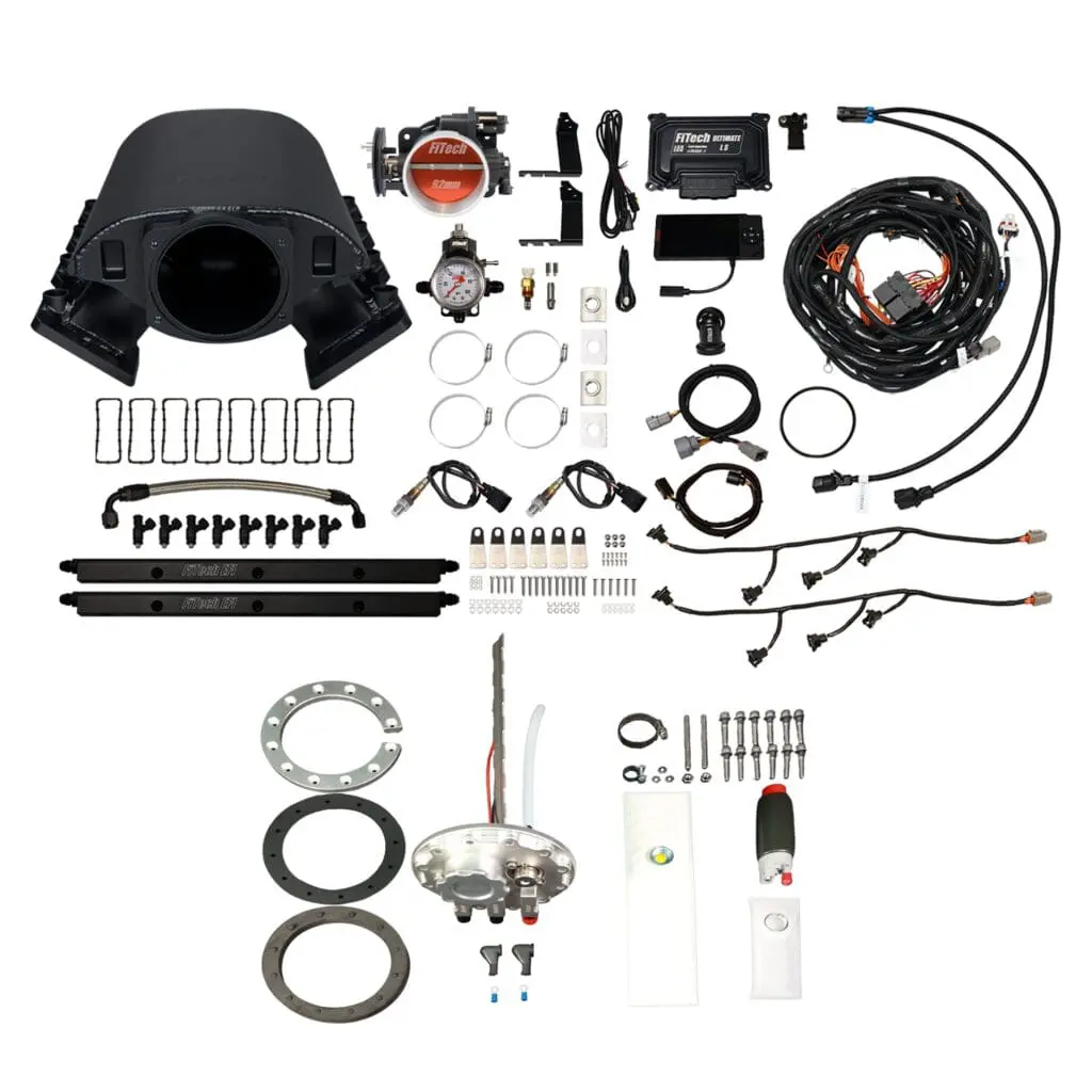 Complete automotive ignition system kit with various components laid out.