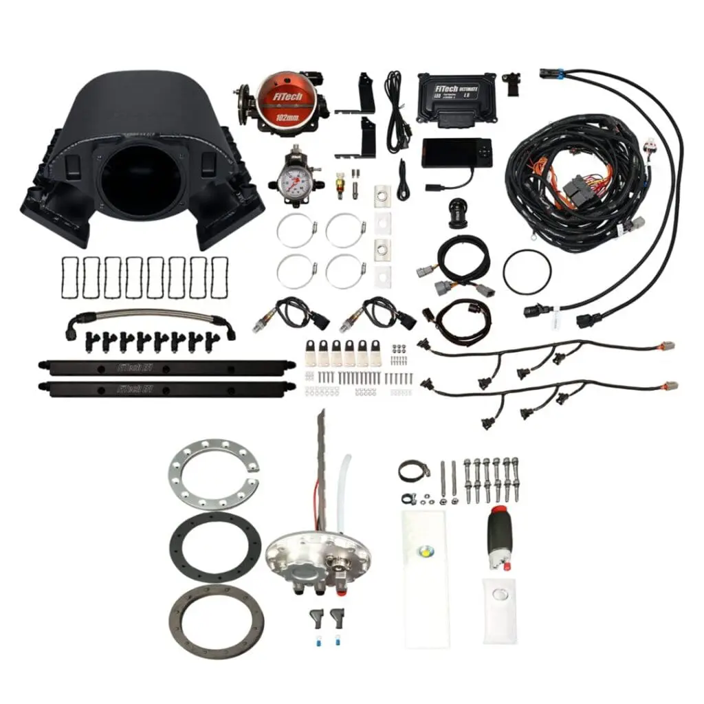 Various automotive parts and hardware components arranged systematically.