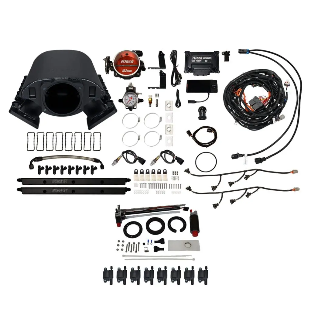 Complete engine rebuild kit with various parts and gaskets.