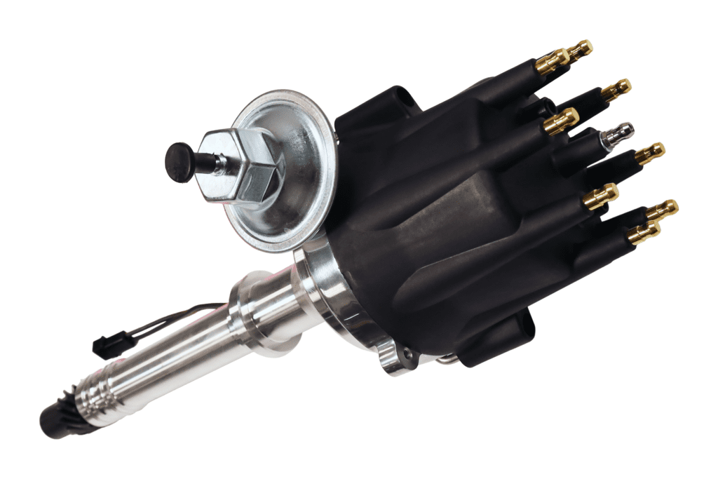 Close-up of a black ignition distributor with metal components.