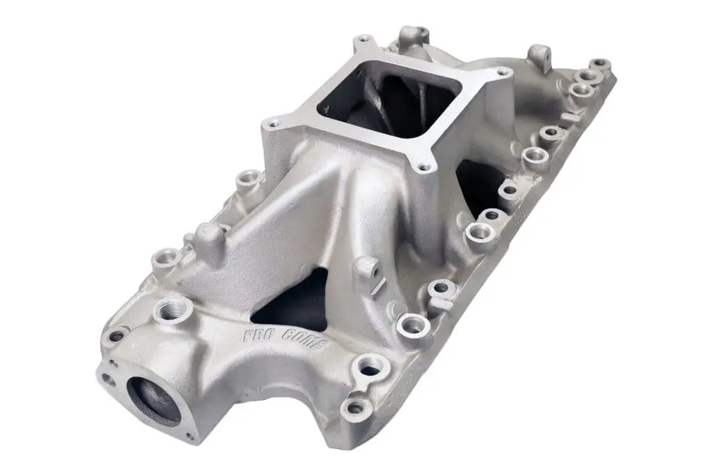 Silver automotive engine intake manifold isolated.