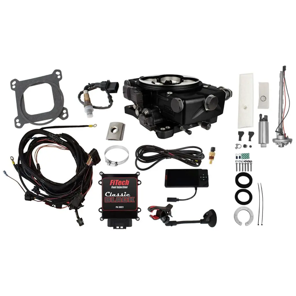 Carburetor kit with various components displayed.