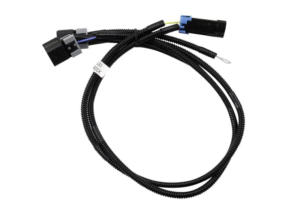 Black automotive wiring harness with connectors.