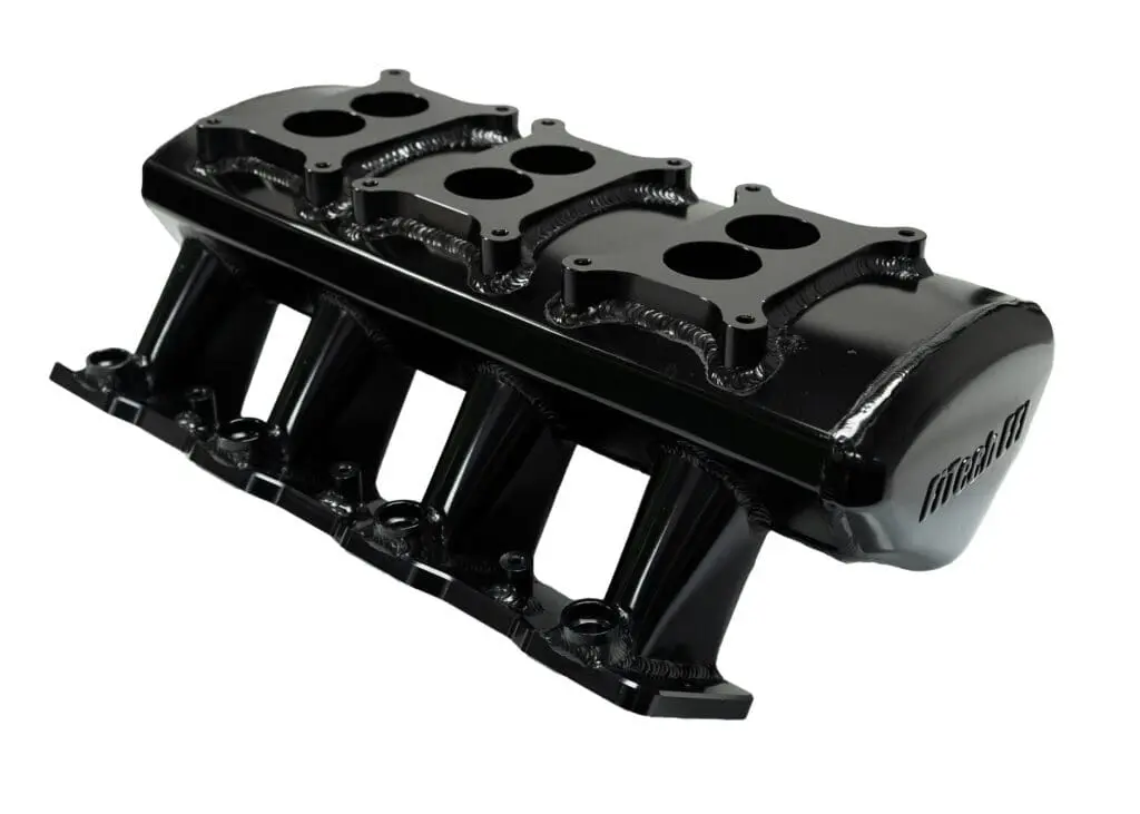 Black engine intake manifold on white background.