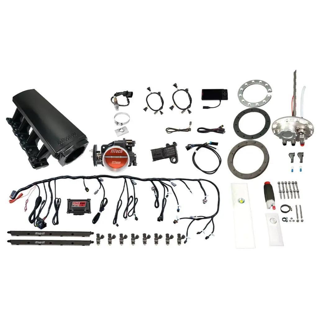 Electronic fuel injection kit components laid out.