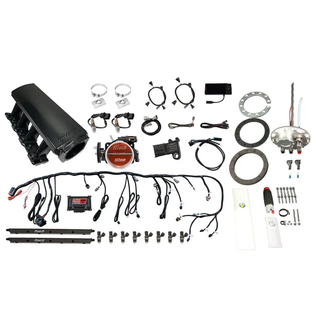 Car engine parts and accessories laid out.
