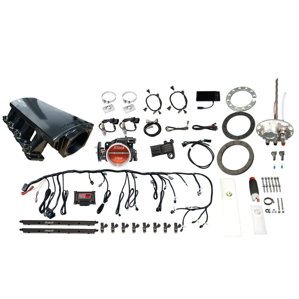 Car engine parts and accessories laid out.
