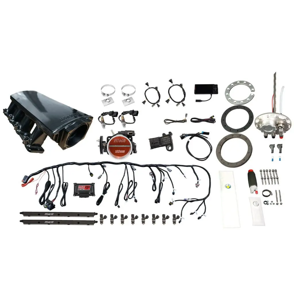 Car engine parts and accessories laid out.