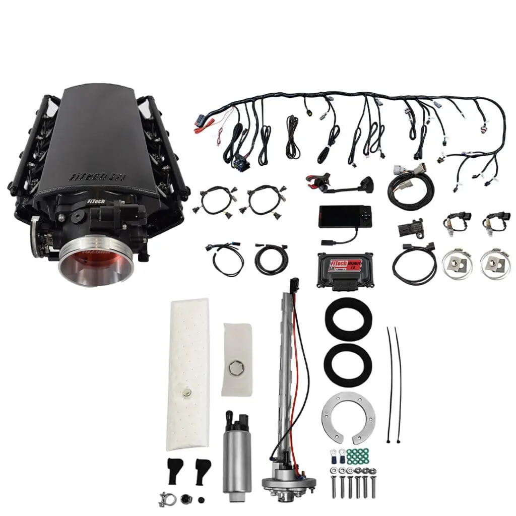 Car engine parts and wiring components displayed.