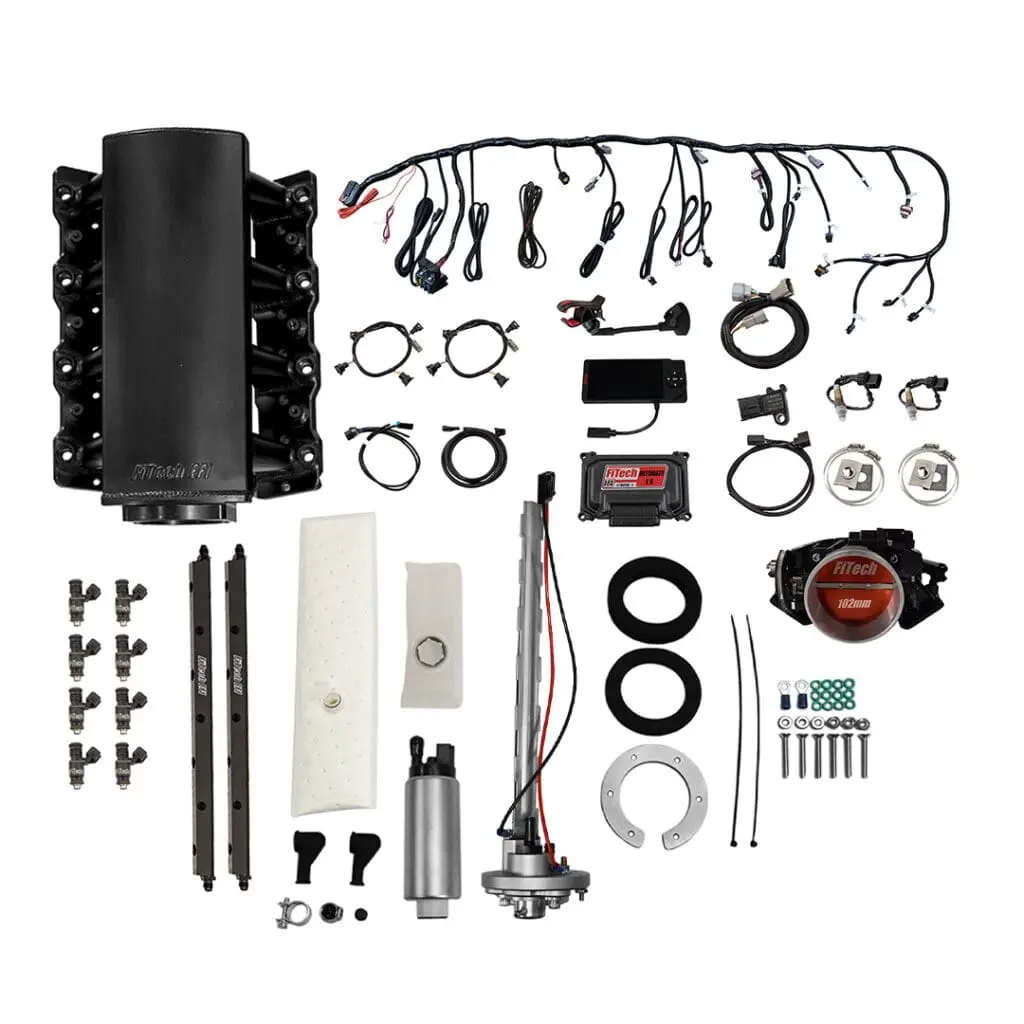 Car engine parts and accessories laid out.
