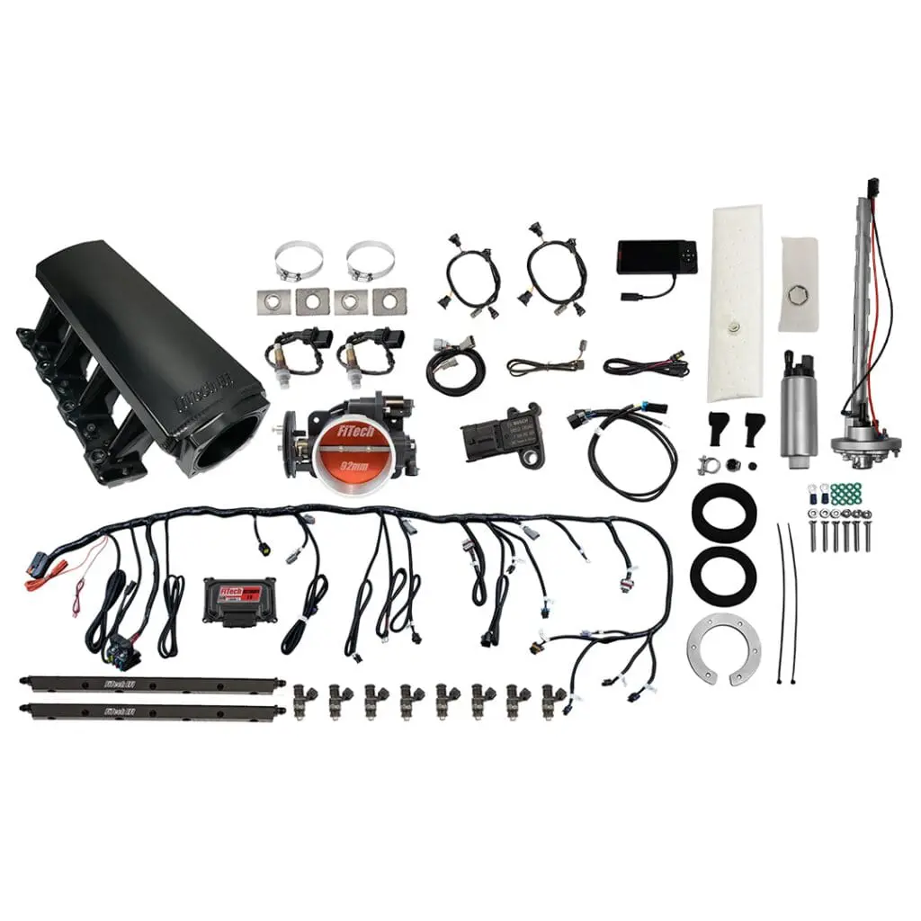 Car engine parts and wiring components displayed.