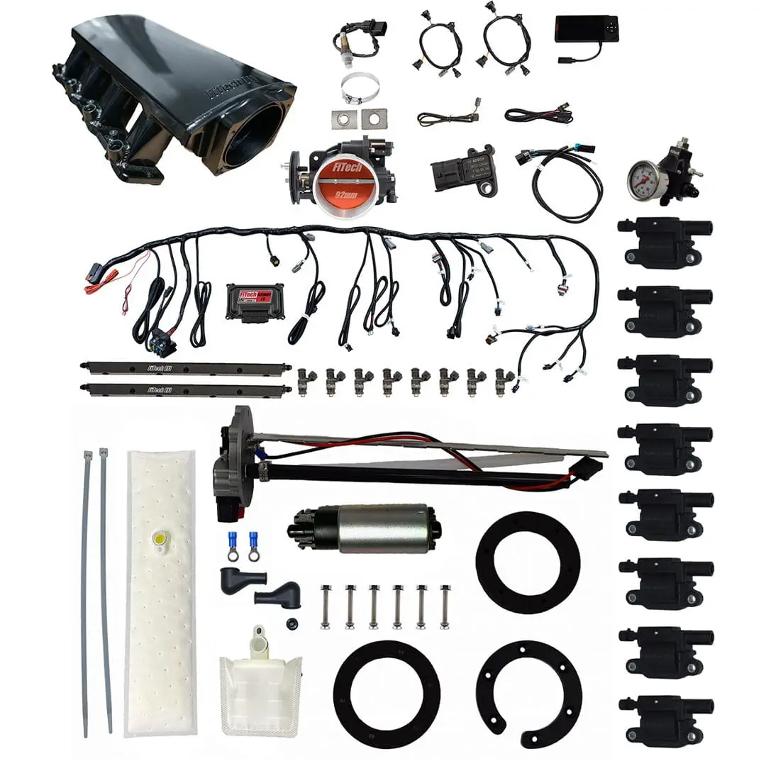 Car engine components and accessories laid out.