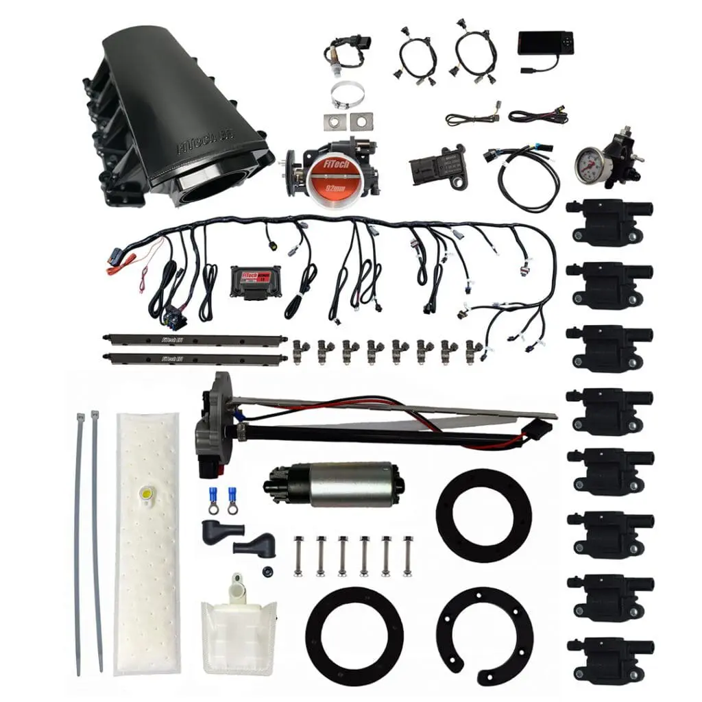 Car engine parts and wiring components displayed.