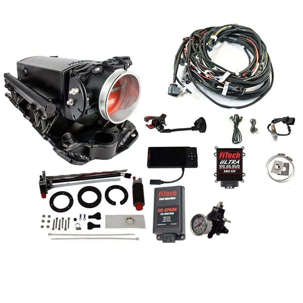 Complete automotive supercharger kit with components and wiring.