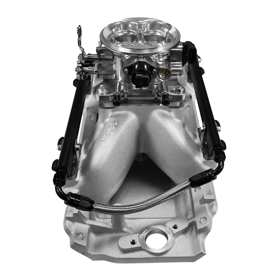Car engine intake manifold on white background.