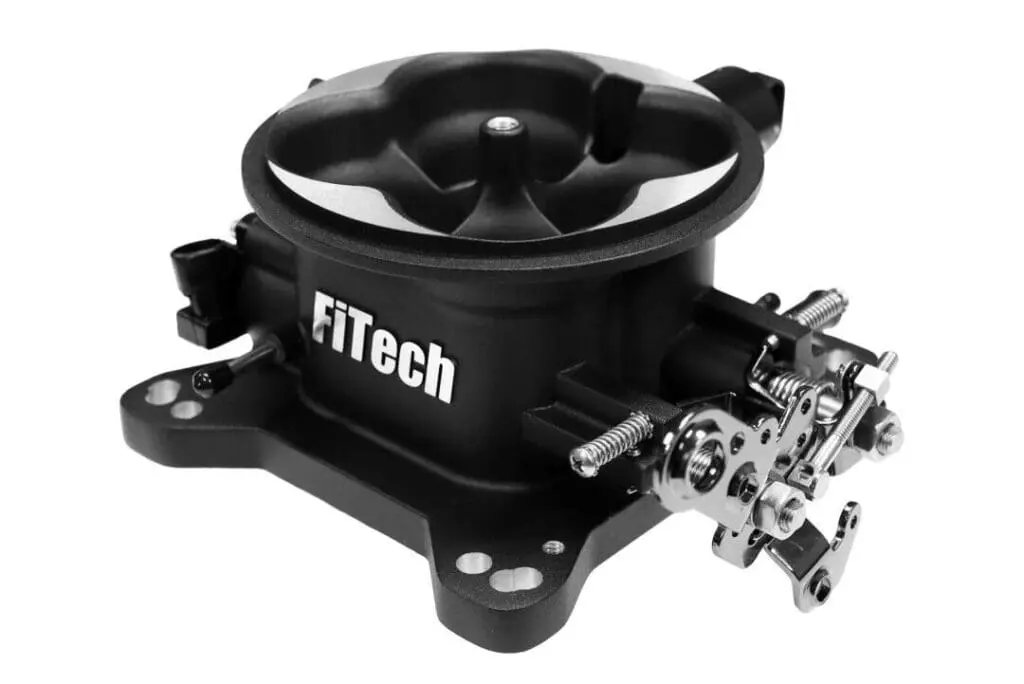 FiTech throttle body on white background.