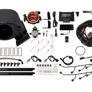 Car engine components and wiring kit laid out.