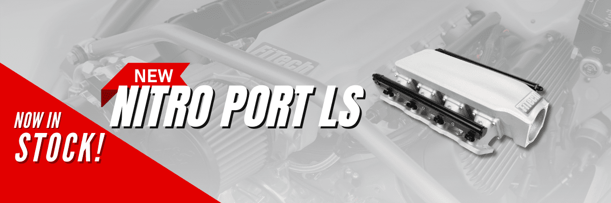 Close-up of a car engine with the text 'TURBO PORT IS'.