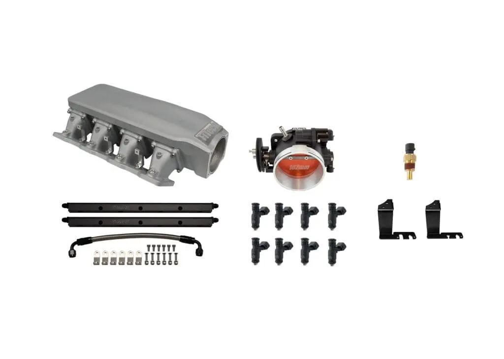 Car engine ignition coil pack kit with connectors and mounting accessories.