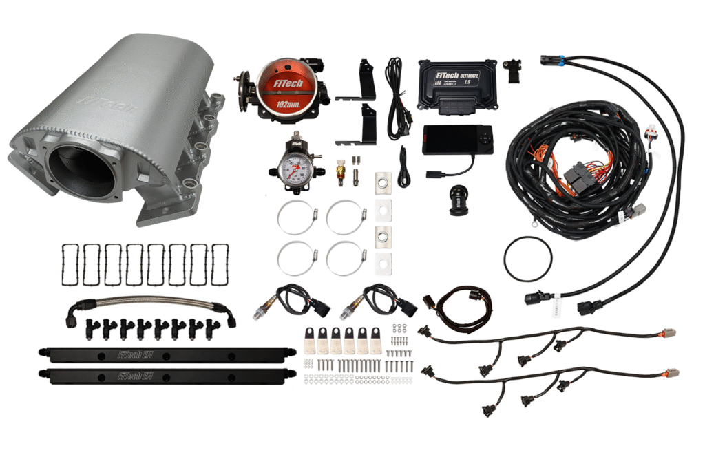 Disassembled automotive turbocharger kit with parts organized neatly.