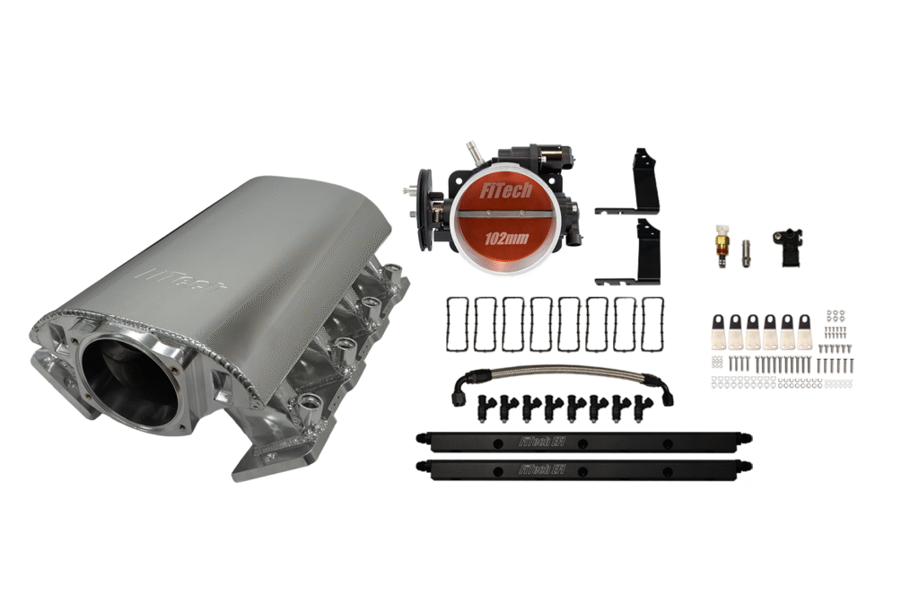 A stainless steel exhaust header with mounting hardware and accessories.