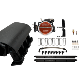 A black automotive intake manifold kit with various components laid out.