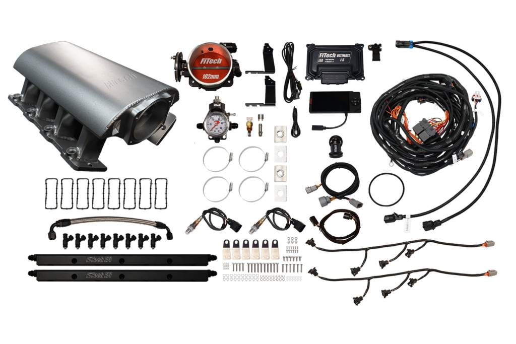 Complete turbocharger installation kit with pipes and wiring.