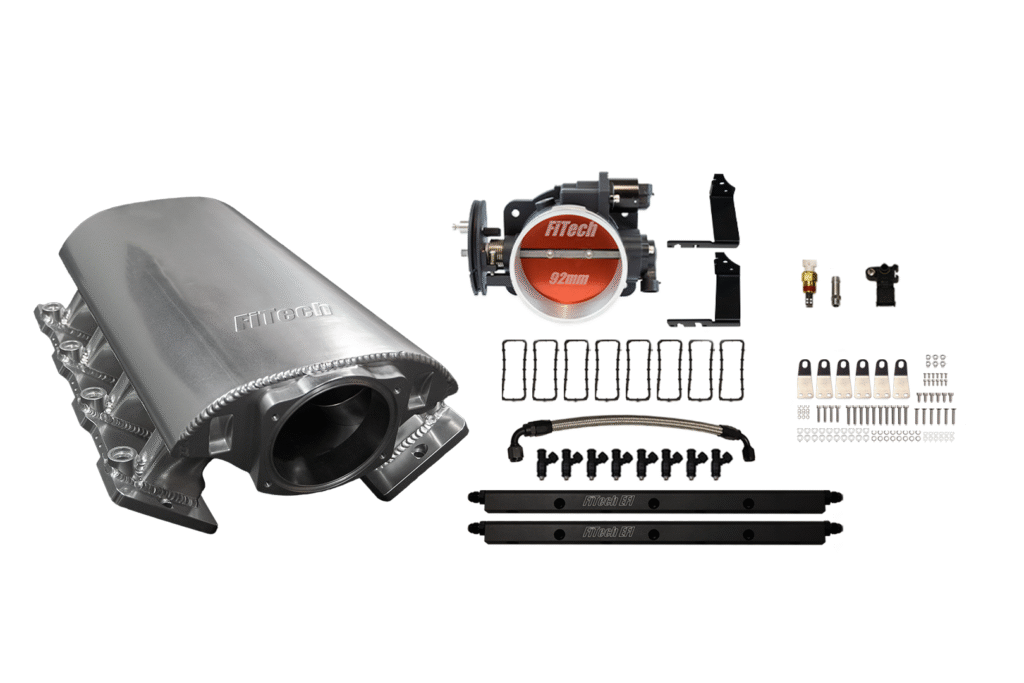 Exhaust system kit with muffler and installation components.