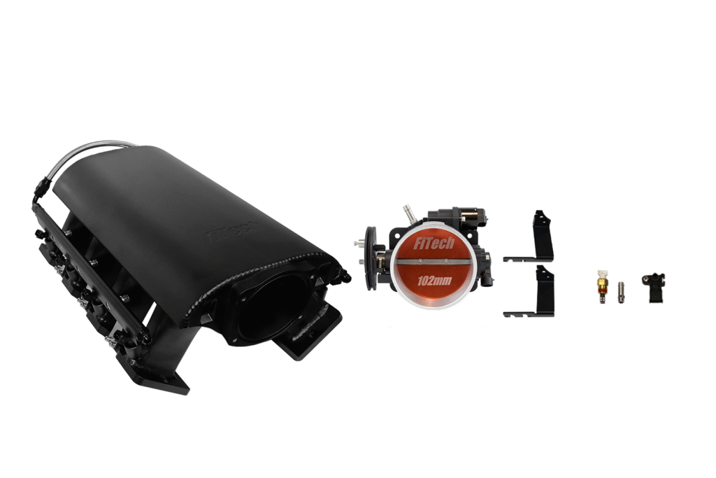 A black surveillance camera and a disassembled red and white smoke detector device.