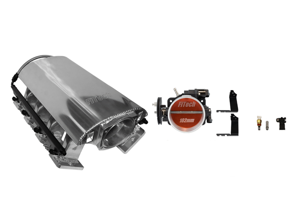 Car engine components including a polished intake manifold and a fuel pressure regulator.