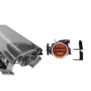 A stainless steel exhaust manifold and a red fuel pressure regulator.