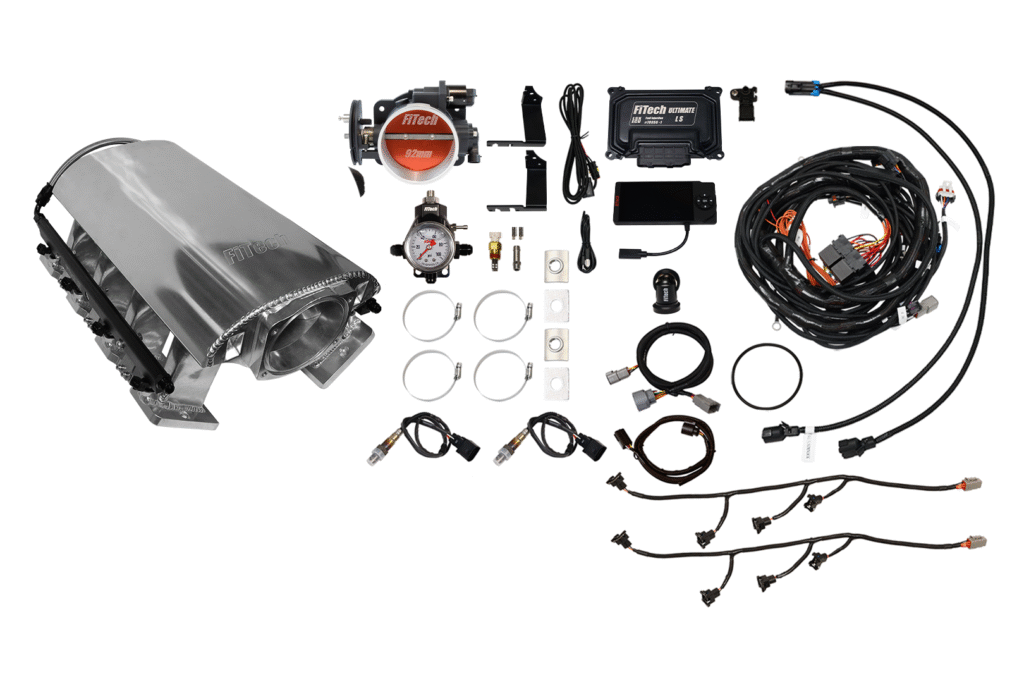 Complete fuel injection system kit with various components and wiring.