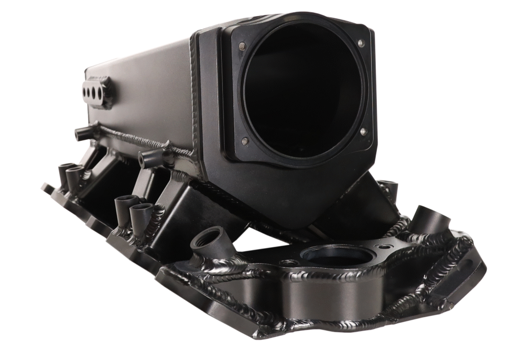 Close-up of a black mechanical part with a cylindrical opening.